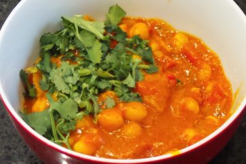 Chickpea Curry in a bowl garnish with coriander