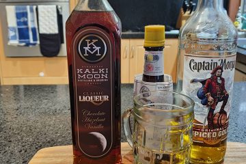 Bottle of rum and liquer with the angostura bitters to make the cocktail