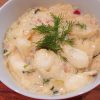 Gnocchi with Creamy Sauerkraut Sauce in a bowl garnished with fresh dill